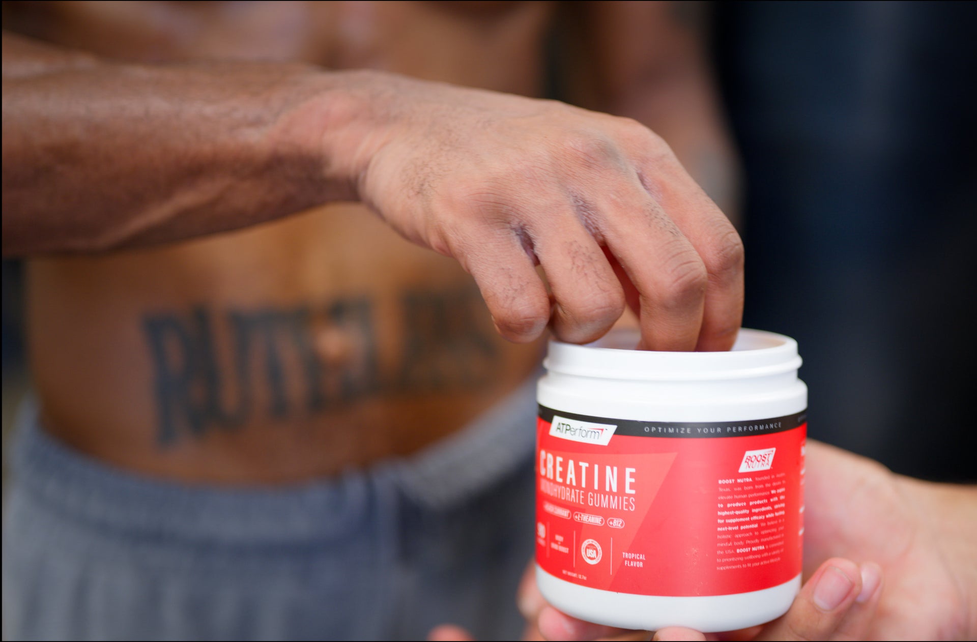 A diverse group of athletes in motion in a vibrant outdoor setting with colorful, sugar-free gummies in the foreground.